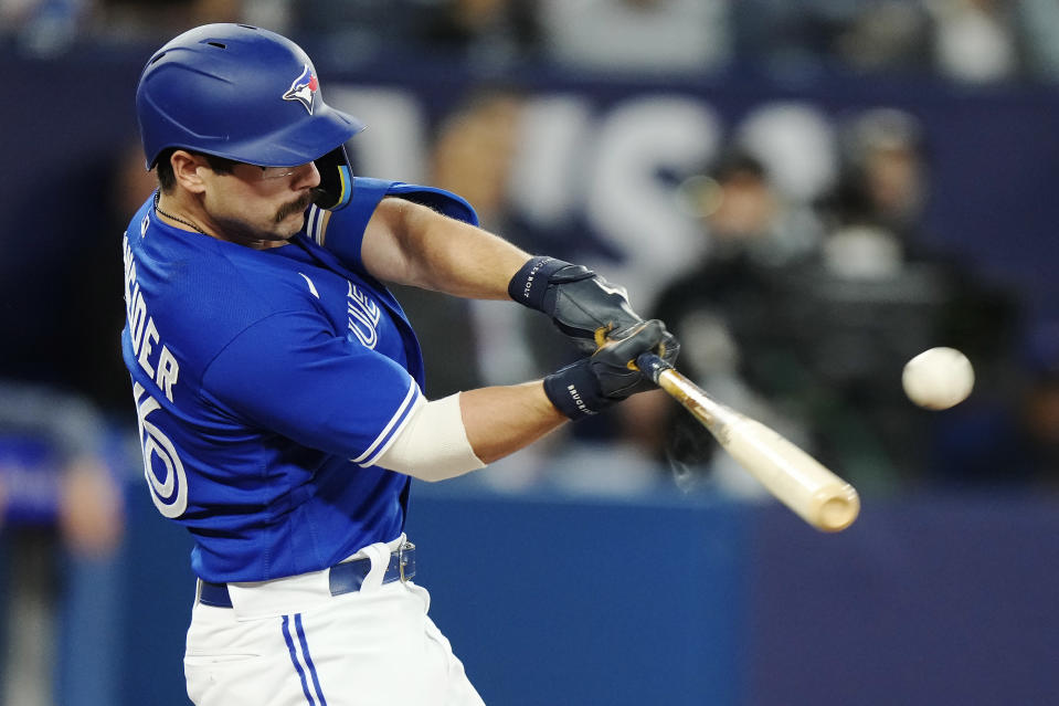 Toronto Blue Jays second baseman Davis Schneider (36) hits a two-run home run against the Cleveland Guardians during the first inning of a baseball game in Toronto on Saturday, Aug. 26, 2023. (Frank Gunn/The Canadian Press via AP)