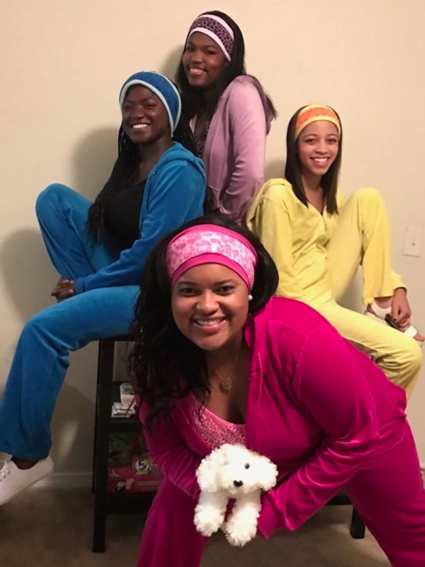 A group of four friends in colorful cheetah-print pajamas