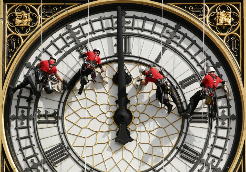 REVIEW OF THE DECADE File photo dated 18/8/2014 of a specialist technical abseil team clean and inspect one of the four faces of the Great Clock, otherwise known as Big Ben, at the Houses of Parliament, in central London, as they undertake essential maintenance and cleaning of the four faces.