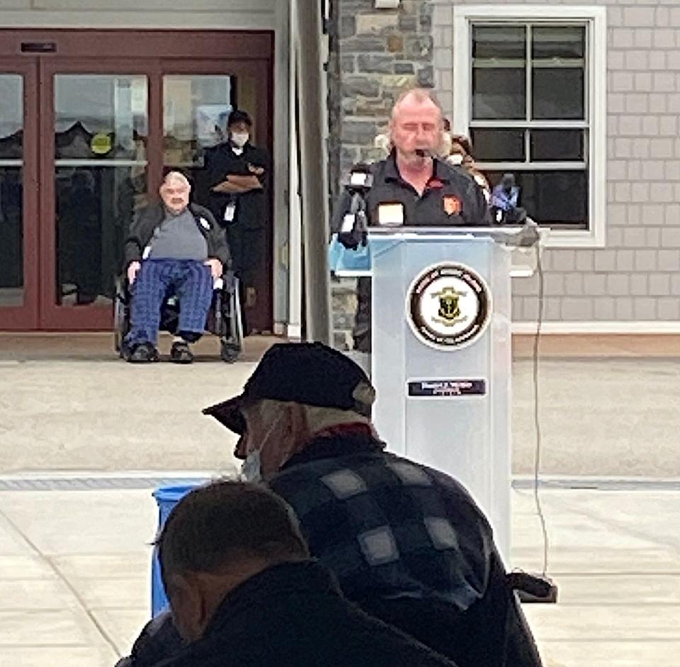 John Twomey, URI Master Gardener, headed up the greenhouse project at the R.I. Veterans Home. Here, he acknowledges the certificate of appreciation presented by Treasurer Seth Magaziner on behalf of the state at the Veterans Day ceremony held at the Home.