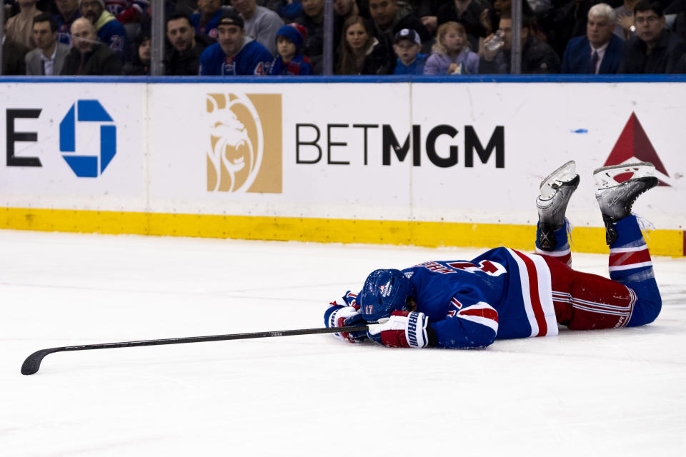 New York Rangers right wing Blake Wheeler (17) collapses to the ice in the first period of an NHL hockey game against the Montreal Canadiens, Thursday, Feb. 15, 2024, in New York. (AP Photo/Peter K. Afriyie)