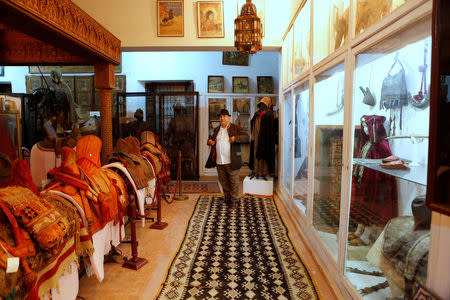 Mohamed Abdelilah Belghazi founder of a museum that collects and safeguards relics showcasing MoroccoÕs religious diversity, poses for a photograph in the museum in Kenitra city near Rabat, Morocco March 28, 2019. Picture taken March 28, 2019, REYTERS/Youssef Boudlal