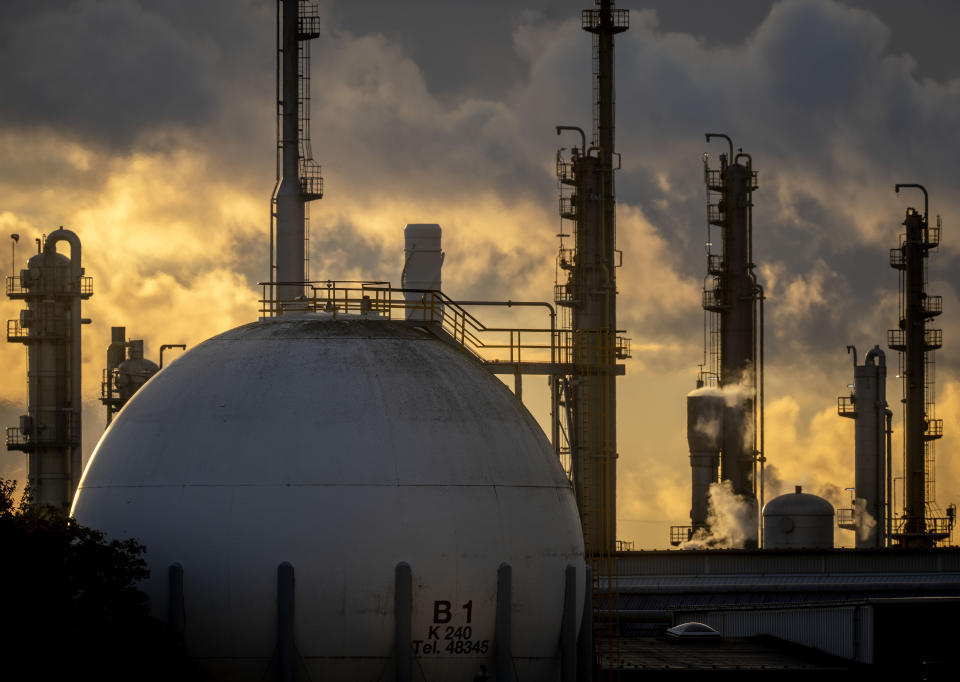 Chimneys and a tank are pictured at the BASF chemical plant in Ludwigshafen, Germany, Tuesday, Sept. 27, 2022. (AP Photo/Michael Probst)