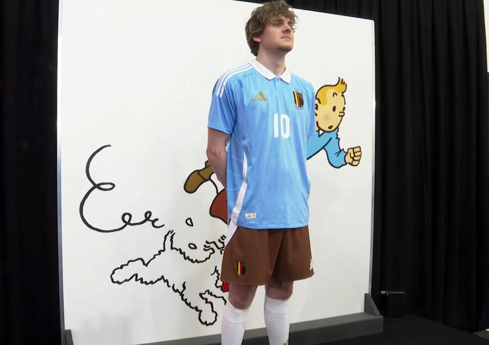 In this grab made from video, a model poses during the unveiling of the new Belgium soccer national team jersey, in Brussels, Belgium, Thursday, March 14, 2024. (SNTV via AP)