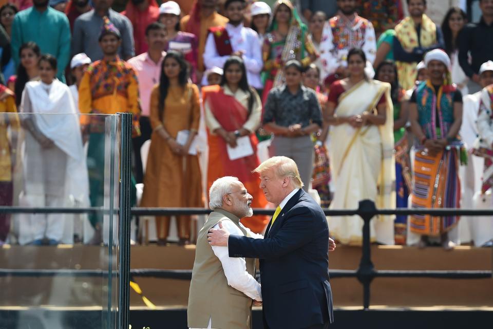 India's Prime Minister Narendra Modi (L) shakes hands with US President Donald Trump during 'Namaste Trump' rally at Sardar Patel Stadium in Motera, on the outskirts of Ahmedabad, on February 24, 2020. (Photo by Money SHARMA / AFP) (Photo by MONEY SHARMA/AFP via Getty Images)