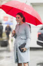 <p>Bumpin’ in the rain! Prince William’s lady glowed and showed, putting her baby belly on display in London on Wednesday. (Photo: Mark Cuthbert/UK Press via Getty Images) </p>