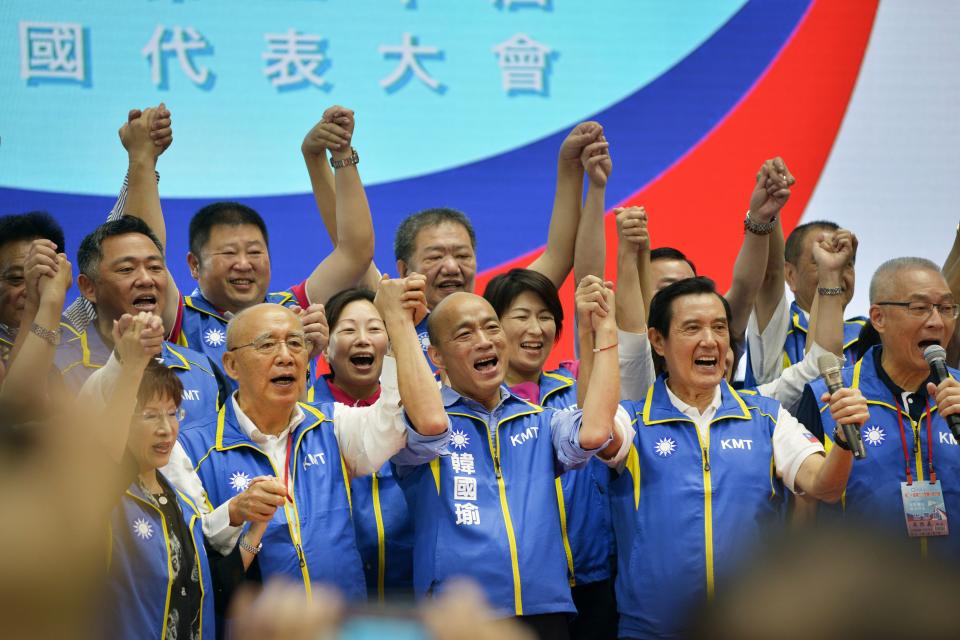 Kuomintang (KMT) party's presidential candidate Han Kuo-yu (front C) gestures with party dignitaries during the KMT national congress in Taipei on July 28, 2019. - Taiwan's upcoming elections will be a "heart-pounding, soul-stirring battle" for the island's future, Beijing-friendly candidate Han Kuo-yu said July 28 in his first speech since becoming the opposition party's presidential candidate. (Photo by Chris STOWERS / AFP)        (Photo credit should read CHRIS STOWERS/AFP/Getty Images)