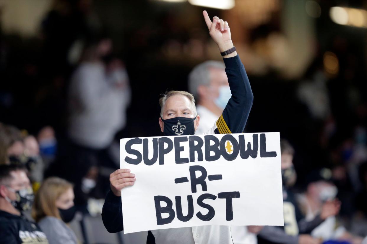 Mandatory Credit: Photo by Brett Duke/AP/Shutterstock (11702238ba)New Orleans Saints fan holds a sign with Super Bowl aspirations in the second half of an NFL wild-card playoff football game against the Chicago Bears in New OrleansBears Saints Football, New Orleans, United States - 10 Jan 2021.