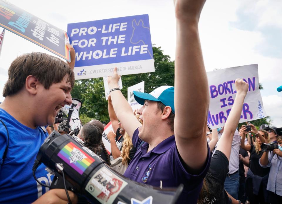 Moments after the Supreme Court issued a decision in a Mississippi abortion case that overturned Roe v Wade.