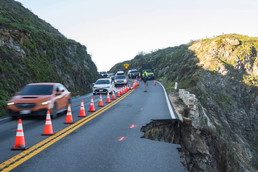 Cars drive north out of Big Sur during a morning caravan past a break in the southbound lane of Highway 1 on Monday, April 1, 2024. (AP Photo/Nic Coury)