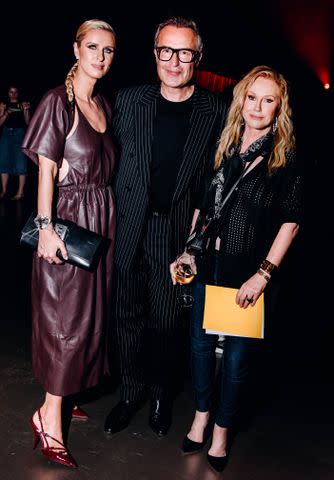 <p>Nina Westervelt/WWD via Getty</p> Nicky Hilton, Michael Coste and Kathy Hilton.