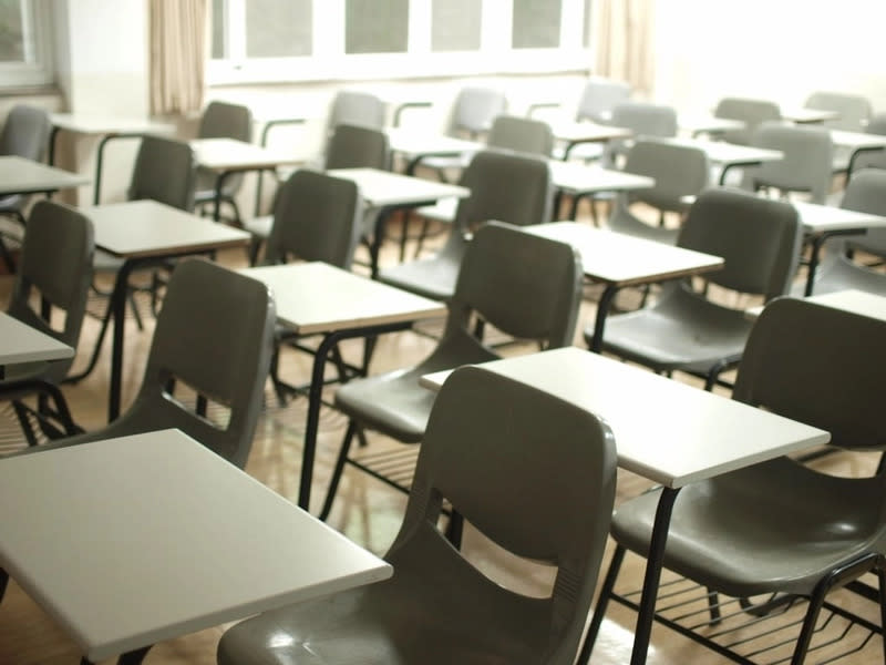 empty school desks in a classroom