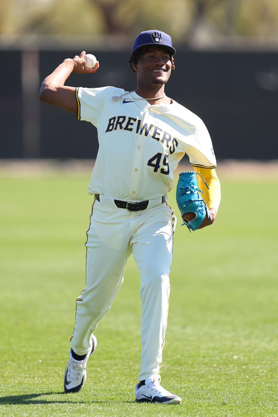 Abner Uribe of the Milwaukee Brewers throws during a spring training workout at American Family Fields of Phoenix.