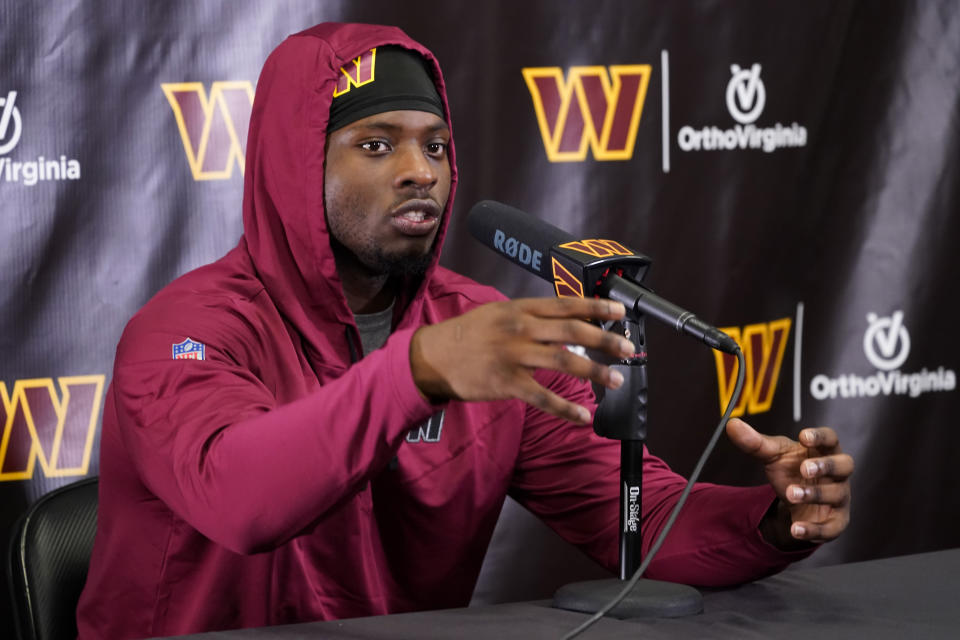 Washington Commanders running back Brian Robinson Jr., speaks after practice at the team's NFL football training facility, Wednesday, Oct. 5, 2022, in Ashburn, Va. Robinson was shot twice in the right leg Aug. 28 in Washington, was taken to a hospital, underwent surgery and was released a day later. The bullets missed all the major ligaments and bones in his knee. (AP Photo/Alex Brandon)