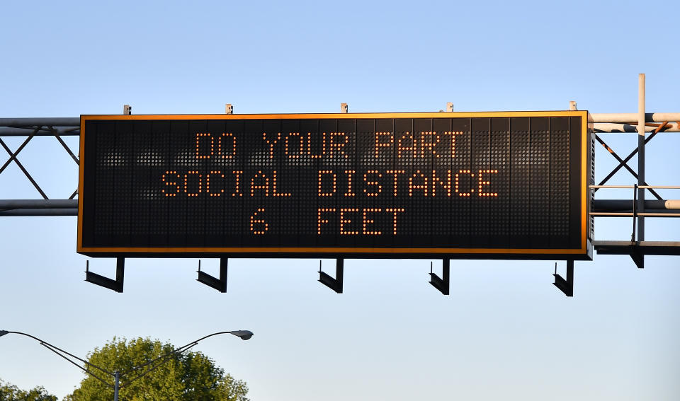 ATLANTA, GA - APRIL 18:  A sign displays "Do Your Part, Social Distance 6 Feet" on Interstate 85 as the coronavirus pandemic continues on April 18, 2020 in Atlanta, Georgia. Georgia Governor Brian Kemp issued an executive order for Georgians to shelter in place due to the coronavirus. There are currently over 17,000 confirmed COVID-19 cases in Georgia. The World Health Organization declared coronavirus (COVID-19) a global pandemic on March 11th. (Photo by Paras Griffin/Getty Images)