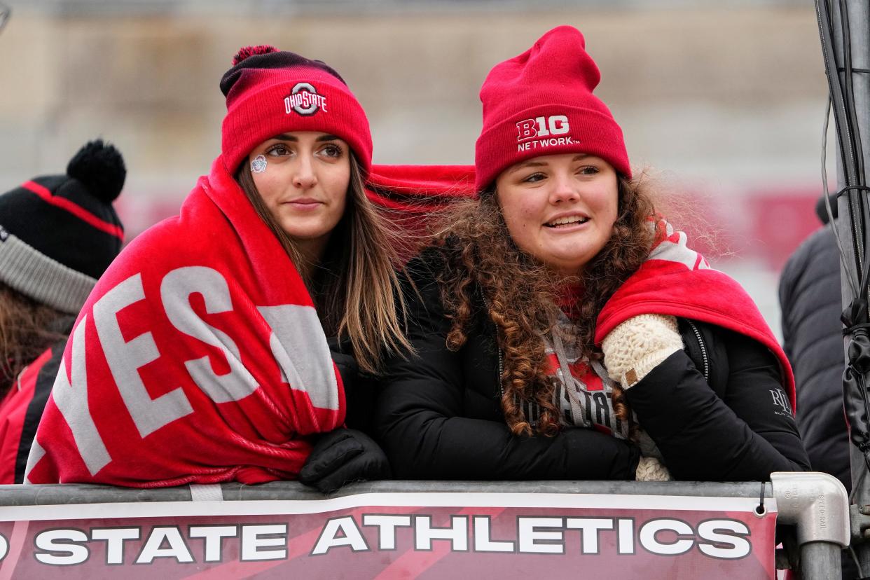 Nov 12, 2022; Columbus, Ohio, USA; With cold weather and flurries in the forecast, Ohio State students Haleigh Shafer, left, and Josie Shiver huddle together for warmth prior to the Buckeyes' NCAA football game against the Indiana Hoosiers at Ohio Stadium. Mandatory Credit: Adam Cairns-The Columbus Dispatch