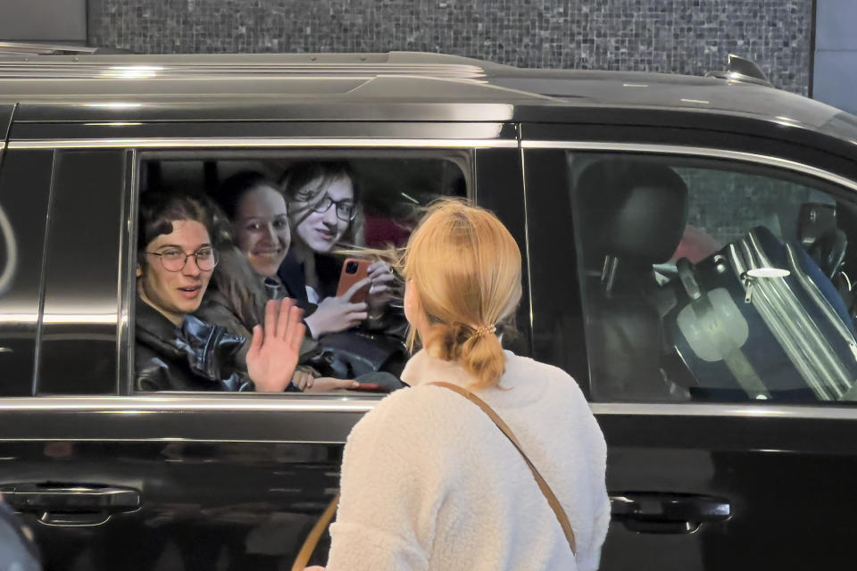 Ukrainian students say goodbye as they depart their hotel for the airport on April 8, 2022, after spending almost a week taking part in the National Model United Nations Conference in New York. (AP Photo/Bobby Caina Calvan)