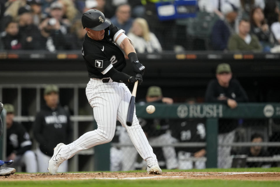 Chicago White Sox's Romy González hits an RBI sacrifice fly off Kansas City Royals starting pitcher Zack Greinke during the second inning of a baseball game Friday, May 19, 2023, in Chicago. (AP Photo/Charles Rex Arbogast)