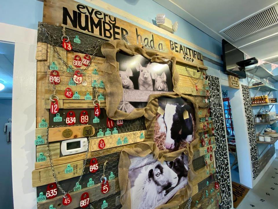 A wall at Oh My Soul features tags that were once used to identify animals for slaughter. “Every number had a beautiful face,” is written across the wall along with images of pigs, cows and sheep. 