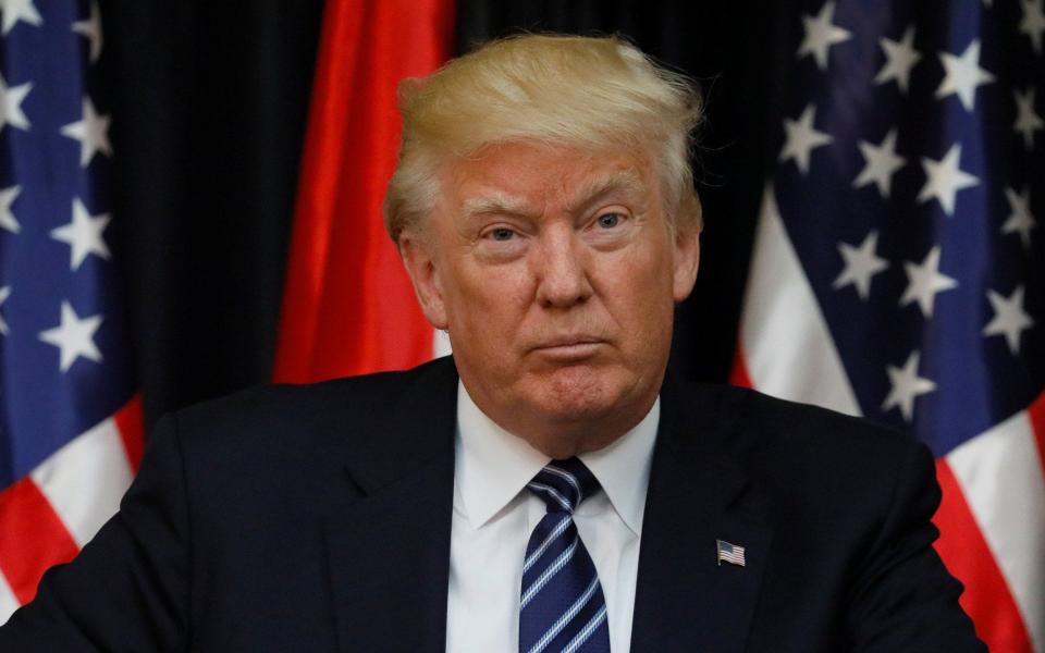 Donald Trump pauses during his comments about the Manchester attack - Credit: JONATHAN ERNST/REUTERS