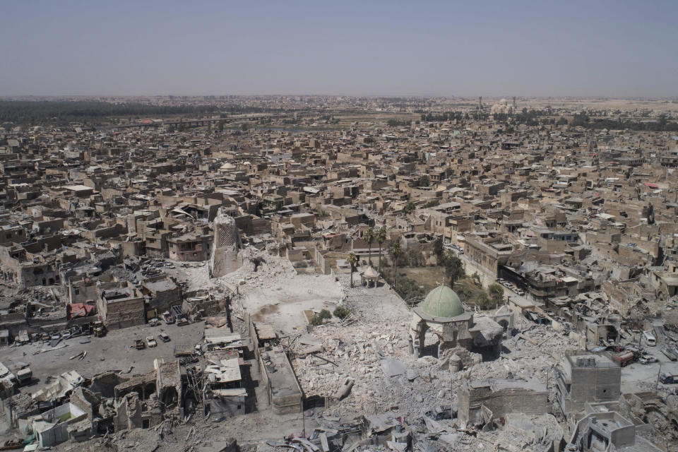 File - Shows an aerial view of the destroyed landmark al-Nuri mosque in the Old City of Mosul, Iraq. Wednesday, June 28, 2017. The United Nations cultural agency has discovered five bombs hidden within the walls the historic al-Nouri Mosque in the city of Mosul in northern Iraq, a remnant of the Islamic State militant group's rule over the area, UNESCO said in a statement Saturday, June 29, 2024. (AP Photo/Felipe Dana, File)