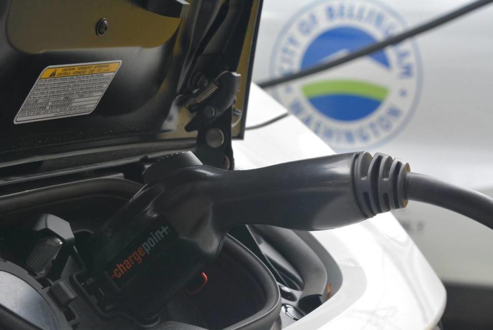 A city of Bellingham electric car is shown connected to a charging station outside the Federal Building on Magnolia Avenue on Tuesday, Bellingham has 94 alternative fuel vehicles, which is 24% of its fleet.