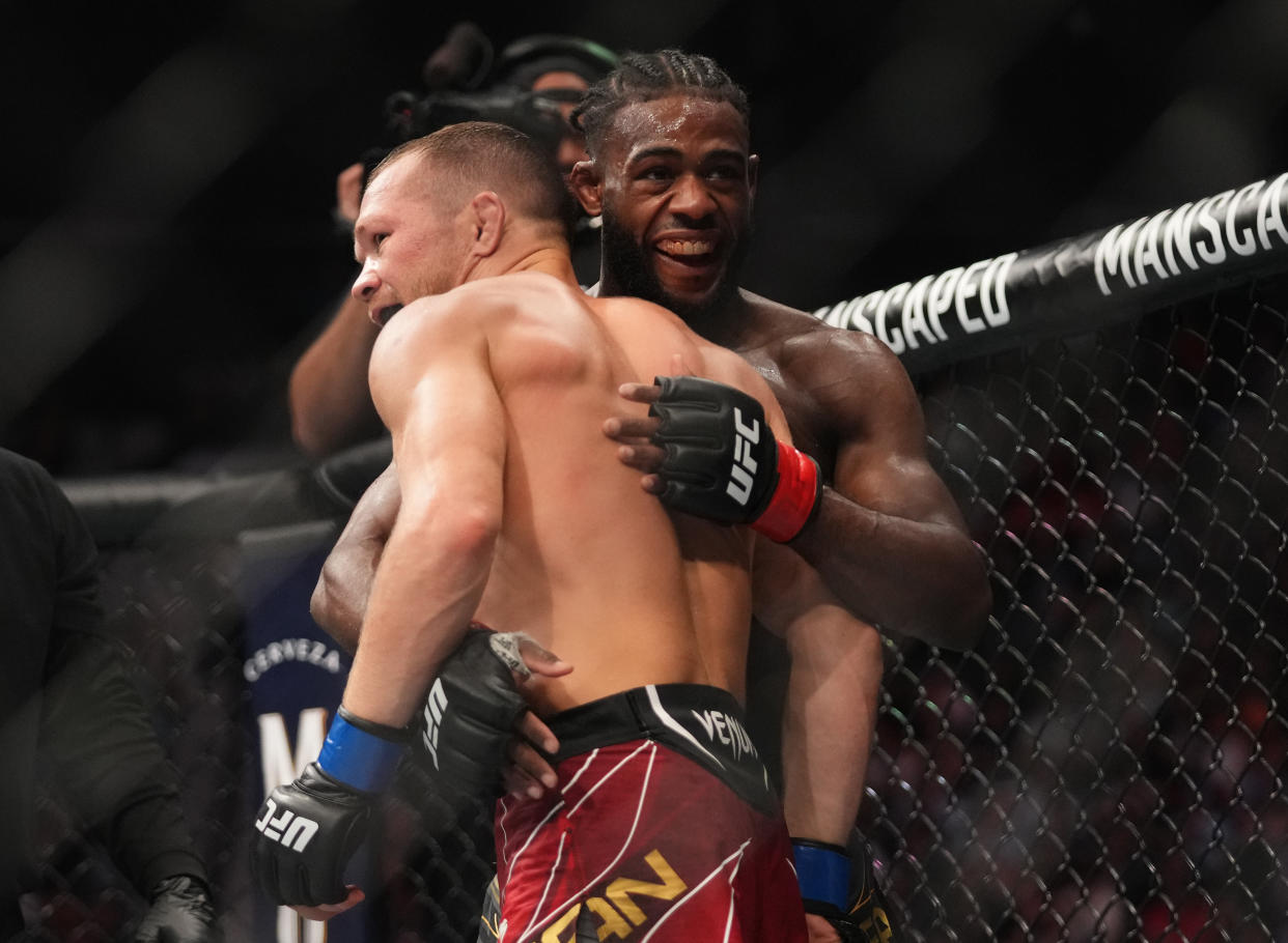 JACKSONVILLE, FLORIDA - APRIL 09: (R-L) Aljamain Sterling and Petr Yan of Russia hug after their UFC bantamweight championship fight during the UFC 273 event at VyStar Veterans Memorial Arena on April 09, 2022 in Jacksonville, Florida. (Photo by Cooper Neill/Zuffa LLC)
