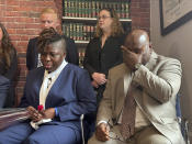 The parents of a teen who died after eating a spicy chip, Lois and Amos Wolobah, participate in a press conference announcing the filing of a lawsuit in the case, Thursday, July 11, 2024, in Boston. Harris Wolobah, a 10th grader from the city of Worcester, died Sept. 1, 2023, after eating the Paqui chip as part of the manufacturer’s “One Chip Challenge.” (AP Photos/Michael Casey)