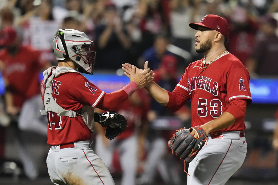 Los Angeles Angels catcher Logan O'Hoppe, left, celebrates with relief pitcher Carlos Estevez, right, after a baseball game against the New York Mets, Friday, Aug. 25, 2023, in New York. (AP Photo/Frank Franklin II)