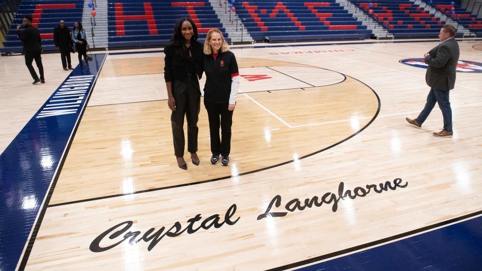 Crystal Langhorne, a Willingboro High School graduate and former WNBA player, is joined by University of Maryland women's basketball coach Brenda Frese, as Langhorne tours the newly refurbished Willingboro High School gym that was renamed after Langhorne on Wednesday, December 13, 2023.