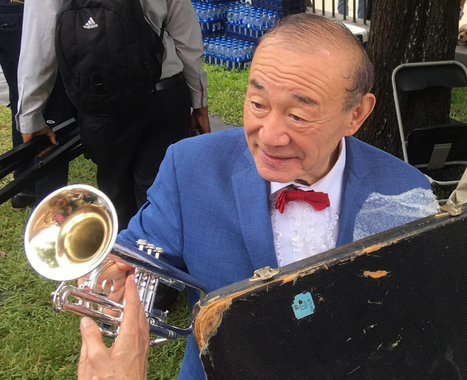 Trumpet player and singer Yoshio Toyama talks with an admirer in New Orleans on Saturday, Aug. 4, 2018. Known as the "Japanese Sachmo" for his devotion to jazz great Louis Armstrong, Toyama and his wife Keiko Toyama performed with their band the Dixie Saints at Satchmo Summerfest, held annually to mark Armstrong's birthday. (AP Photo/Jay Reeves)