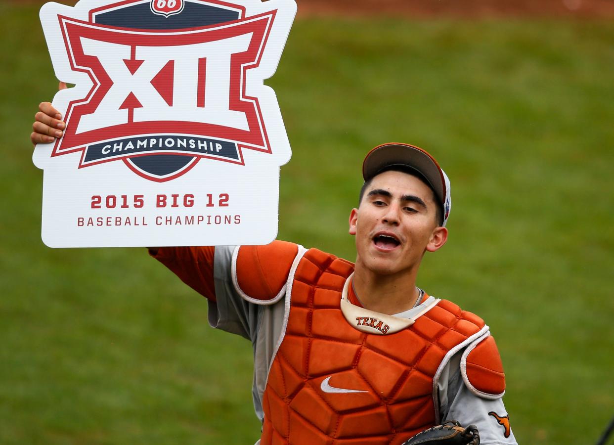 Texas catcher Tres Barrera celebrates after Texas defeated Oklahoma State in the championship game of the NCAA college Big 12 conference baseball tournament in Tulsa, Okla., Sunday, May 24, 2015. Texas won 6-3. (AP Photo/Sue Ogrocki)