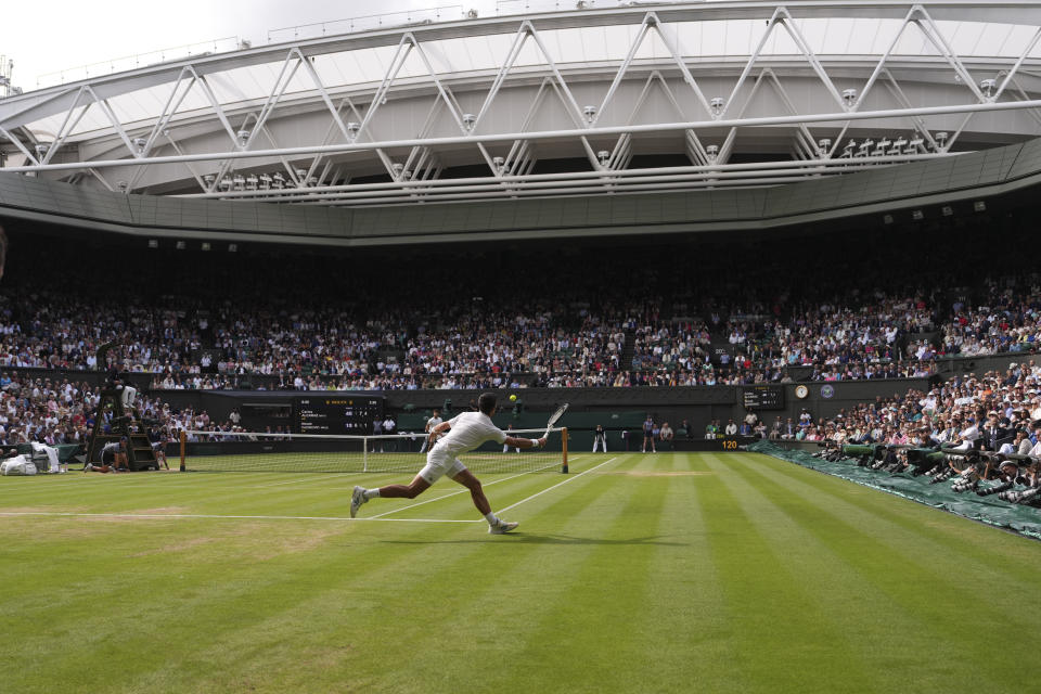 Serbia's Novak Djokovic in action against Spain's Carlos Alcaraz during the men's singles final on day fourteen of the Wimbledon tennis championships in London, Sunday, July 16, 2023. (AP Photo/Alberto Pezzali)