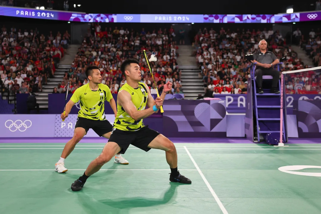 羽球男雙李洋／王齊麟，奧運羽球男子雙打金牌二連霸！（Photo by Michael Reaves/Getty Images）