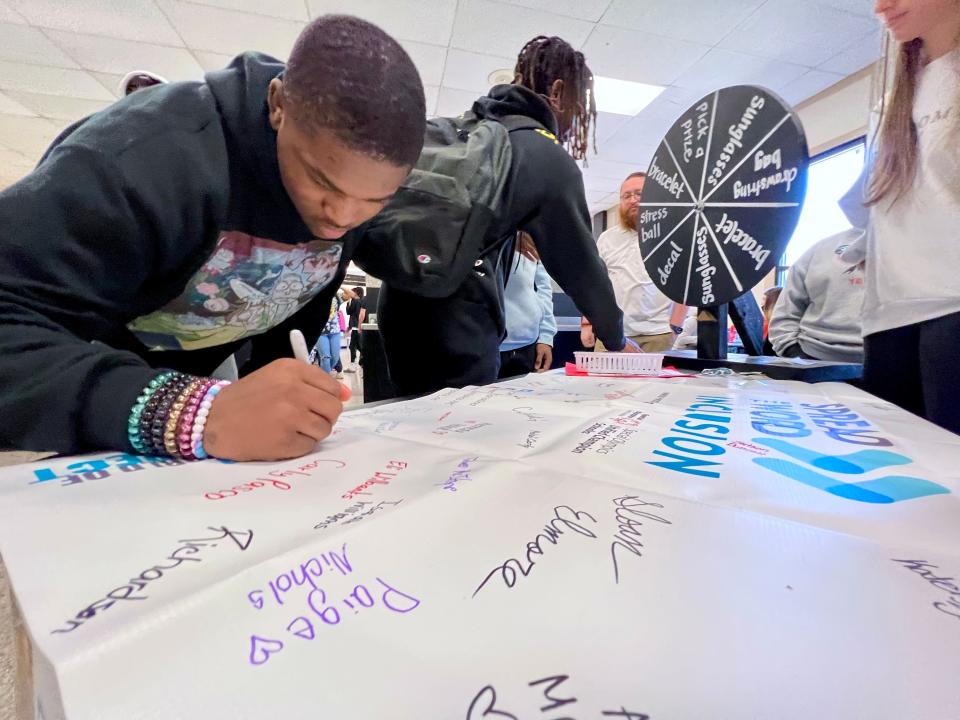 Ty'Jai Johnson pledges to be more inclusive during an event at Shelby High School.