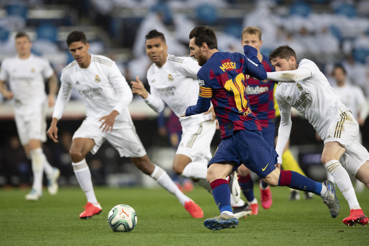 Barcelona's Lionel Messi taking on Real Madrid players in El Clasico in February this year. (PHOTO: LaLiga Santandar)