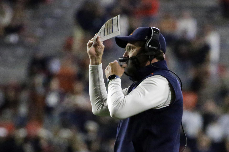 Auburn coach Gus Malzahn signals to his players during the first half of the team's NCAA college football game against Tennessee on Saturday, Nov. 21, 2020, in Auburn, Ala. (AP Photo/Butch Dill)