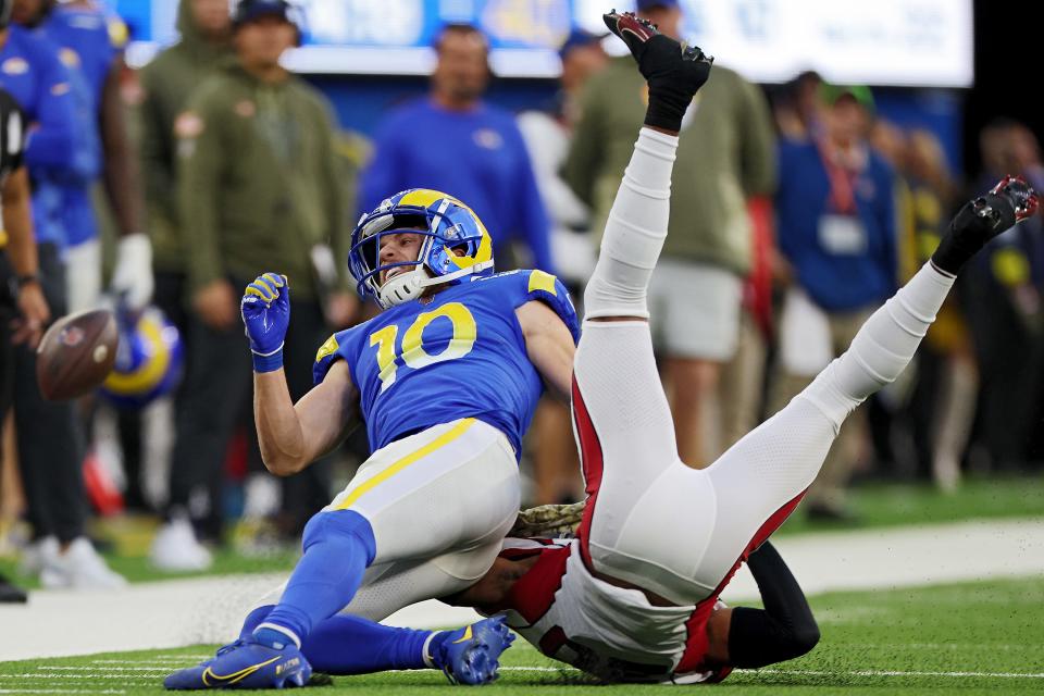 Cooper Kupp reacts after being hit by Marco Wilson.