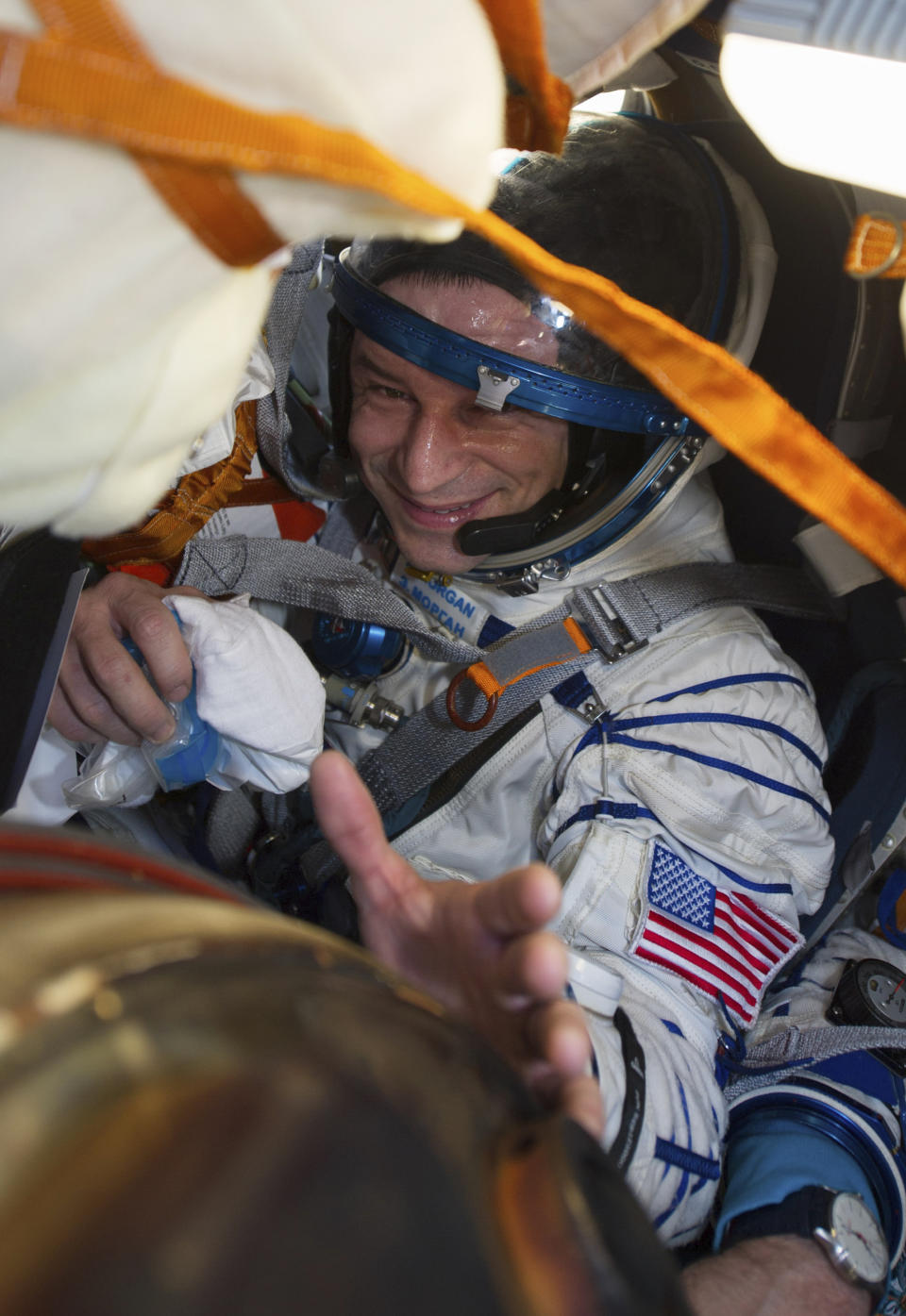 In this handout photo released by Gagarin Cosmonaut Training Centre (GCTC), Roscosmos space agency, U.S. astronaut Andrew Morgan sits in the capsule shortly after the landing of the Russian Soyuz MS-15 space capsule near Kazakh town of Dzhezkazgan, Kazakhstan, Friday, April 17, 2020. An International Space Station crew has landed safely after more than 200 days in space. The Soyuz capsule carrying NASA astronauts Andrew Morgan, Jessica Meir and Russian space agency Roscosmos' Oleg Skripochka touched down on Friday on the steppes of Kazakhstan. (Andrey Shelepin, Gagarin Cosmonaut Training Centre (GCTC), Roscosmos space agency, via AP)