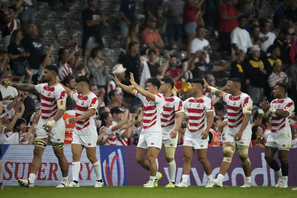 Japan's players walk around the pitch after the end of the during the Rugby World Cup Pool D match between Japan and Samoa, at the Stadium de Toulouse in Toulouse, France, Thursday, Sept. 28, 2023. (AP Photo/Christophe Ena)