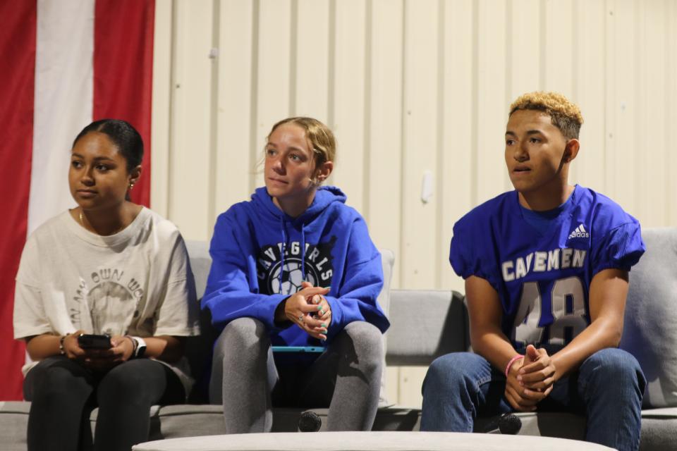 From left: Carlsbad High School student-athletes Kaysha Amos, Abby Dugan, Marley Munoz listen to former Dallas Cowboy Drew Pearson during the Carlsbad Mayor's Energy Summit on Oct. 19, 2023.