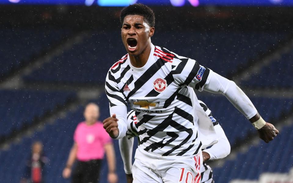 Marcus Rashford celebrates scoring the winner - AFP