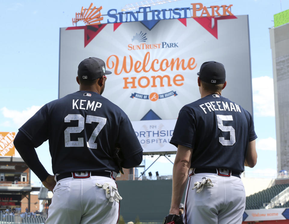 Atlanta Braves' Matt Kemp (27) and Freddie Freeman take in their new home as they prepare to play an exhibition baseball game against the New York Yankees for the soft opening of SunTrust Park on Friday, March 31, 2017, in Atlanta. (Curtis Compton/Atlanta Journal-Constitution via AP)