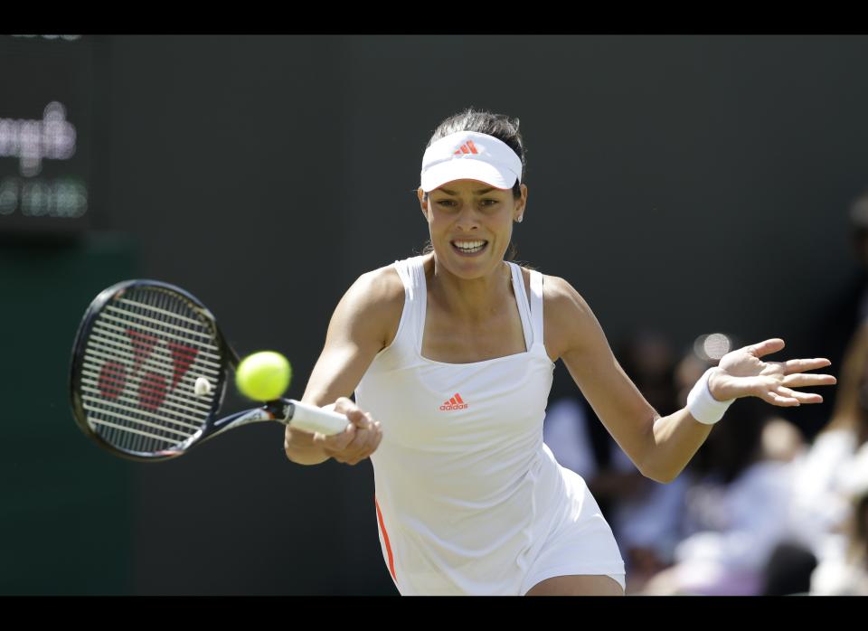 Ana Ivanovic of Serbia returns a shot to Julia Goerges of Germany during a third round women's singles match at the All England Lawn Tennis Championships at Wimbledon, England, Saturday, June 30, 2012.