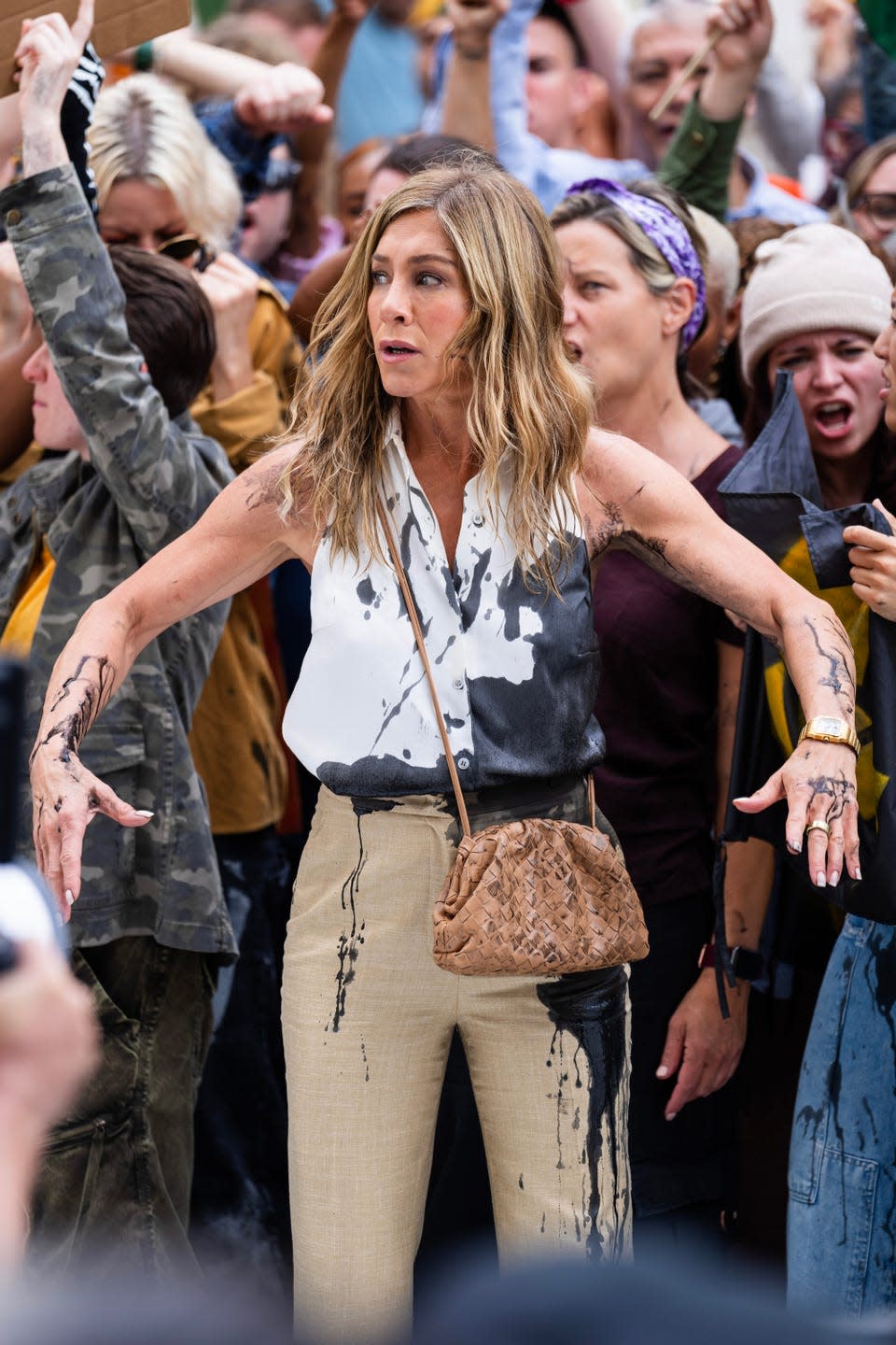 jennifer aniston gets covered in oil while filming a scene for the morning show