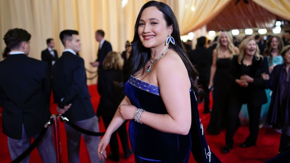 Lily Gladstone walking the 2024 Oscars red carpet in Hollywood. - John Locher/Invision/AP