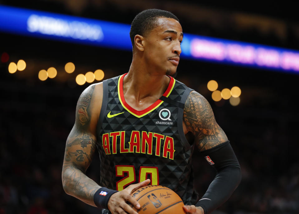 ATLANTA, GA - FEBRUARY 29: John Collins #20 of the Atlanta Hawks rebounds during the first half of an NBA game against the Portland Trail Blazers at State Farm Arena on February 29, 2020 in Atlanta, Georgia. NOTE TO USER: User expressly acknowledges and agrees that, by downloading and/or using this photograph, user is consenting to the terms and conditions of the Getty Images License Agreement. (Photo by Todd Kirkland/Getty Images)