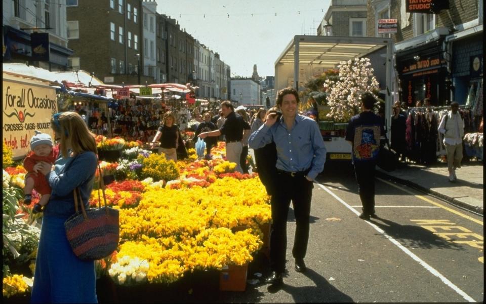 Not real: Hugh Grant swans through Notting Hill in the 1999 film - Credit: Film Stills