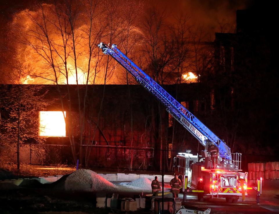 Akron firefighters respond to a fire at the former site of a rubber factory off Beech Street, near North Howard Street, Wednesday in Akron.