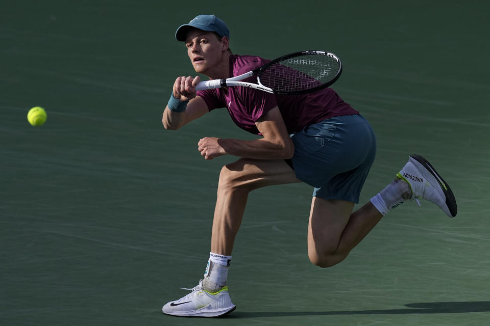 Jannik Sinner, of Italy, returns a shot against Carlos Alcaraz, of Spain, during a semifinal match at the BNP Paribas Open tennis tournament Saturday, March 18, 2023, in Indian Wells, Calif. (AP Photo/Mark J. Terrill)